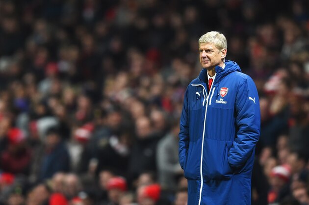 LONDON, ENGLAND - DECEMBER 13:  Arsene Wenger, manager of Arsenal smiles after the second goal of Olivier Giroud of Arsenal during the Barclays Premier League match between Arsenal and Newcastle United at Emirates Stadium on December 13, 2014 in London, England.  (Photo by Paul Gilham/Getty Images)