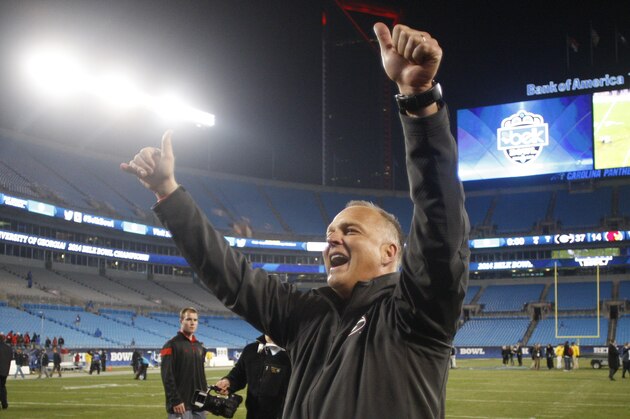 Georgia coach Mark Richt waves to the school's band after Georgia's 37-14 win over Louisville in the Belk Bowl NCAA college football game in Charlotte, N.C., Tuesday, Dec. 30, 2014. Georgia won 37-14. (AP Photo/Nell Redmond)