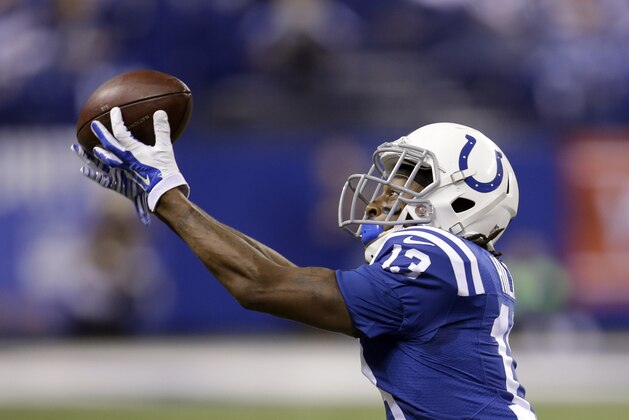 Indianapolis Colts wide receiver T.Y. Hilton reaches for a pass during the first half of an NFL wildcard playoff football game against the Cincinnati Bengals Sunday, Jan. 4, 2015, in Indianapolis. (AP Photo/AJ Mast)
