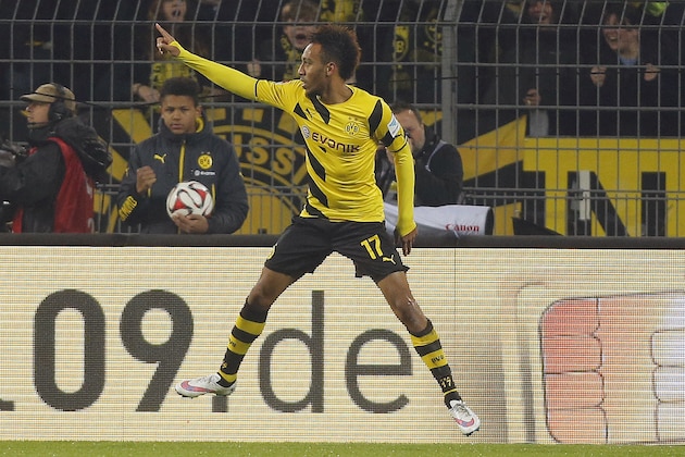 Dortmund's Pierre-Emerick Aubameyang celebrates after scoring during the German first division Bundesliga soccer match between Borussia Dortmund and VfL Wolfsburg in Dortmund, Germany, Wednesday, Dec. 17, 2014. (AP Photo/Frank Augstein)