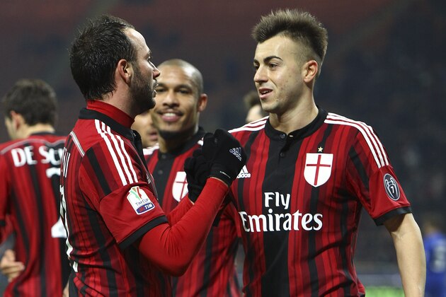 MILAN, ITALY - JANUARY 13:  Giampaolo Pazzini (L) of AC Milan celebrates with his team-mate Stephan El Shaarawy (R) after scoring the opening goal during the TIM Cup match between AC Milan and US Sassuolo Calcio at Stadio Giuseppe Meazza on January 13, 2015 in Milan, Italy.  (Photo by Marco Luzzani/Getty Images)
