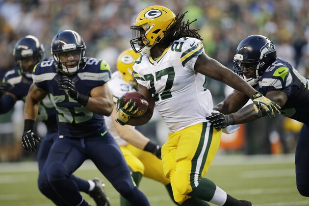 Green Bay Packers running back Eddie Lacy rushes against the Seattle Seahawks in the second half of an NFL football game, Thursday, Sept. 4, 2014, in Seattle. (AP Photo/Scott Eklund)
