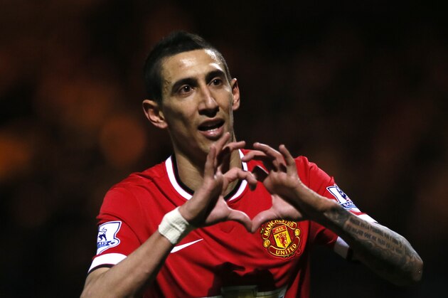 Manchester United’s Angel Di Maria celebrates after scoring his sides second goal of the game during their English FA Cup third round soccer match between Yeovil Town and Manchester United at Huish Park stadium in Yeovil, England, Sunday, Jan.  4, 2015 . (AP Photo/Alastair Grant)