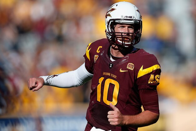 TEMPE, AZ - NOVEMBER 22:  Quarterback Taylor Kelly #10 of the Arizona State Sun Devils reacts after throwing a six yard touchdown reception to tight end Kody Kohl (not pictured) during the fourth quarter of the college football game against the Washington State Cougars at Sun Devil Stadium on November 22, 2014 in Tempe, Arizona.  The Sun Devils defeated the Cougars 52-31. (Photo by Christian Petersen/Getty Images)