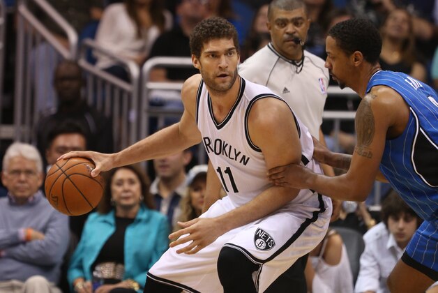 Jan 2, 2015; Orlando, FL, USA; Orlando Magic forward Channing Frye guards against Brooklyn Nets center Brook Lopez (11) during the second half of a NBA basketball game at Amway Center. Mandatory Credit: Reinhold Matay-USA TODAY Sports