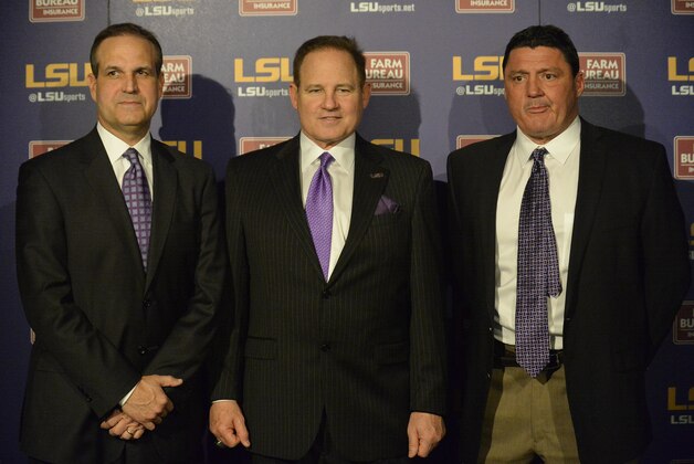 From left to right, LSU defensive coordinator Kevin Steele, head coach Les Miles and defensive line coach Ed Orgeron stand together during a news conference at Louisiana State in Baton Rouge, La., Wednesday, Jan. 14, 2015. (AP Photo/Hilary Scheinuk)