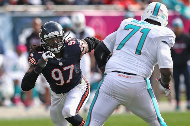CHICAGO, IL - OCTOBER 19:  Willie Young #97 of the Chicago Bears rushes against  Branden Albert #71 of the Miami Dolphins at Soldier Field on October 19, 2014 in Chicago, Illinois. The Dolphins defeated the Bears 27-14.  (Photo by Jonathan Daniel/Getty Images)