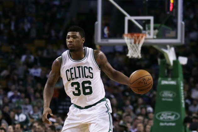 Boston Celtics guard Marcus Smart (36) dribbles the ball up court during the second half of an NBA basketball game in Boston, Monday, Jan. 12, 2015. The Celtics defeated the Pelicans 108-100. (AP Photo/Charles Krupa)