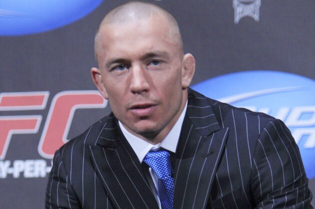 Georges St. Pierre holds his championship belt during a news conference at Radio City Music Hall, Wednesday, March 24, 2010 in New York.  Ultimate Fighting Championship returns to the Prudential Center in Newark, N.J., for UFC 111 on Saturday, March 27th. (AP Photo/Mary Altaffer)