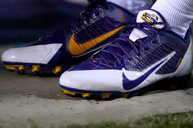 The Nike logo is seen on an LSU player's cleats during the first half of an NCAA college football game in Baton Rouge, La., Saturday, September 6, 2014. (AP Photo/Jonathan Bachman)