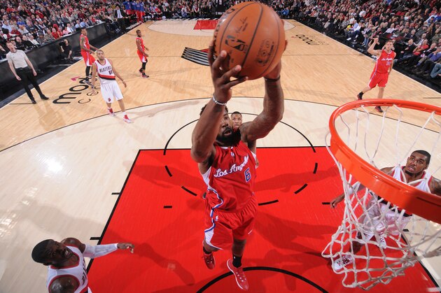 PORTLAND, OR - JANUARY 14:  DeAndre Jordan #6 of the Los Angeles Clippers grabs the rebound against the Portland Trail Blazers during the game on January 14, 2015 at the Moda Center in Portland, Oregon. NOTE TO USER: User expressly acknowledges and agrees that, by downloading and or using this Photograph, user is consenting to the terms and conditions of the Getty Images License Agreement. Mandatory Copyright Notice: Copyright 2015 NBAE (Photo by Sam Forencich/NBAE via Getty Images)