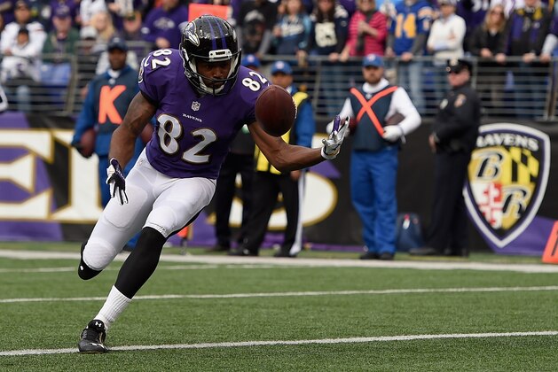 BALTIMORE, MD - NOVEMBER 30:  Wide receiver Torrey Smith #82 of the Baltimore Ravens catches a touchdown in the first quarter of a game against the San Diego Chargers at M&T Bank Stadium on November 30, 2014 in Baltimore, Maryland.  (Photo by Patrick Smith/Getty Images)