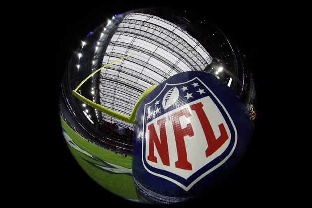 The NFL logo is seen on a goalpost pad before an NFL football game between the Houston Texans and the Baltimore Ravens Sunday, Dec. 21, 2014, in Houston. (AP Photo/David J. Phillip)