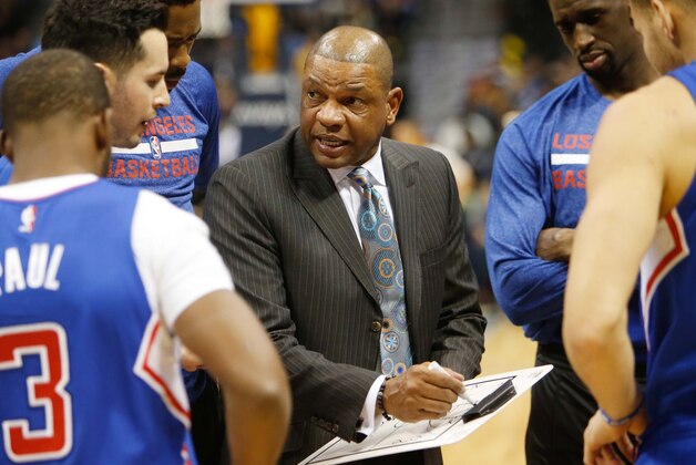 Dec 19, 2014; Denver, CO, USA; Los Angeles Clippers head coach Doc Rivers talks with his team before the game against the Denver Nuggets at Pepsi Center.  The Nuggets won 109-106. Mandatory Credit: Chris Humphreys-USA TODAY Sports