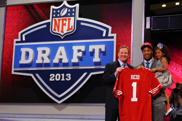 NEW YORK, NY - APRIL 25:  Eric Reid (C) of the LSU Tigers holds his daughter Leilani as they stand with NFL Commissioner Roger Goodell as they hold up a jersey on stage after Reid was picked #18 overall by the San Francisco 49ers in the first round of the 2013 NFL Draft at Radio City Music Hall on April 25, 2013 in New York City.  (Photo by Al Bello/Getty Images)