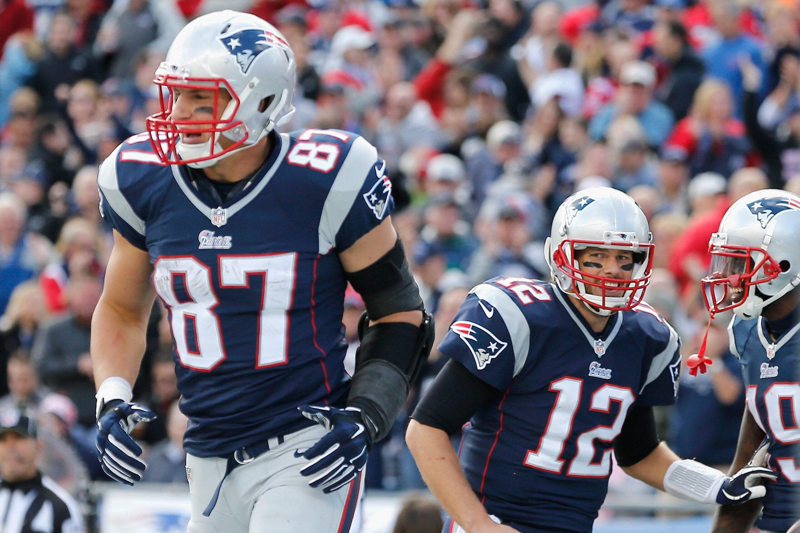 FOXBORO, MA - OCTOBER 26:  Rob Gronkowski #87, Tom Brady #12, and Brandon LaFell#19 of the New England Patriots react after LaFell caught a touchdown pass during the second quarter against the Chicago Bears at Gillette Stadium on October 26, 2014 in Foxboro, Massachusetts.  (Photo by Jim Rogash/Getty Images)