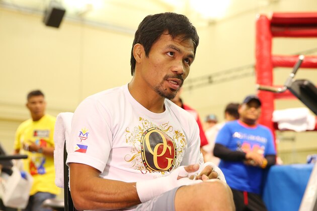MACAU - NOVEMBER 20:  Manny Pacquiao prepares to train during a workout session at The Venetian on November 20, 2014 in Macau, Macau.  (Photo by Chris Hyde/Getty Images)