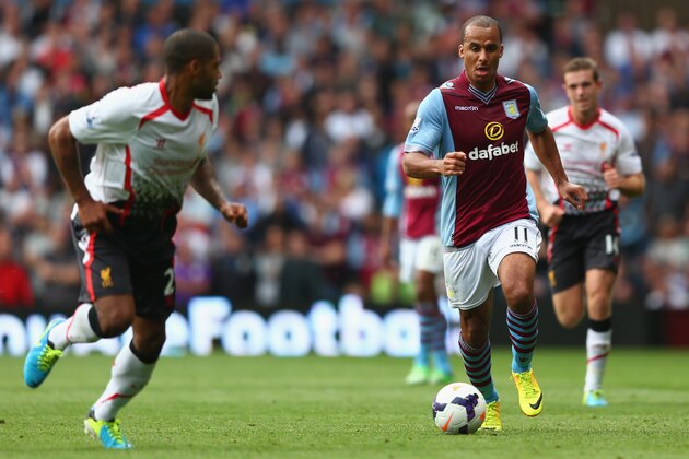 BIRMINGHAM, ENGLAND - AUGUST 24:  Gabriel Agbonlahor (R) of Aston Villa runs at Glen Johnson (L) of Liverpool during the Barclays Premier League match between Aston Villa and Liverpool at Villa Park on August 24, 2013 in Birmingham, England.  (Photo by Michael Steele/Getty Images)
