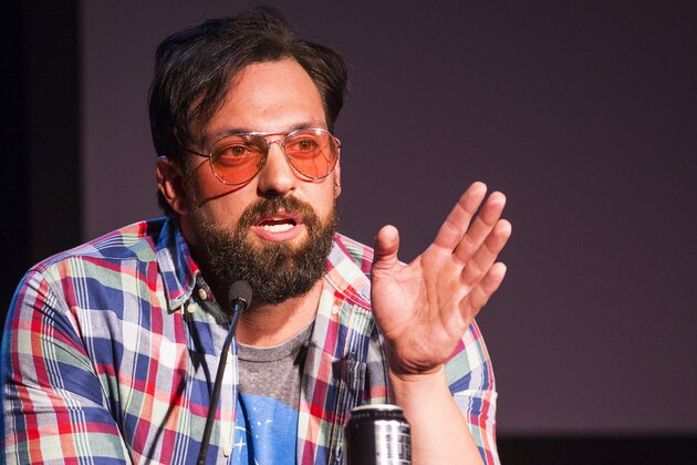 WWE Superstart Damien Sandow, dressed as a stereotypical gamer, addresses media at the WWE 2K15 Press Event at Cicada on Saturday, August 16, 2014 in Los Angeles. (Photo by Colin Young-Wolff/Invision for 2K/AP Images)