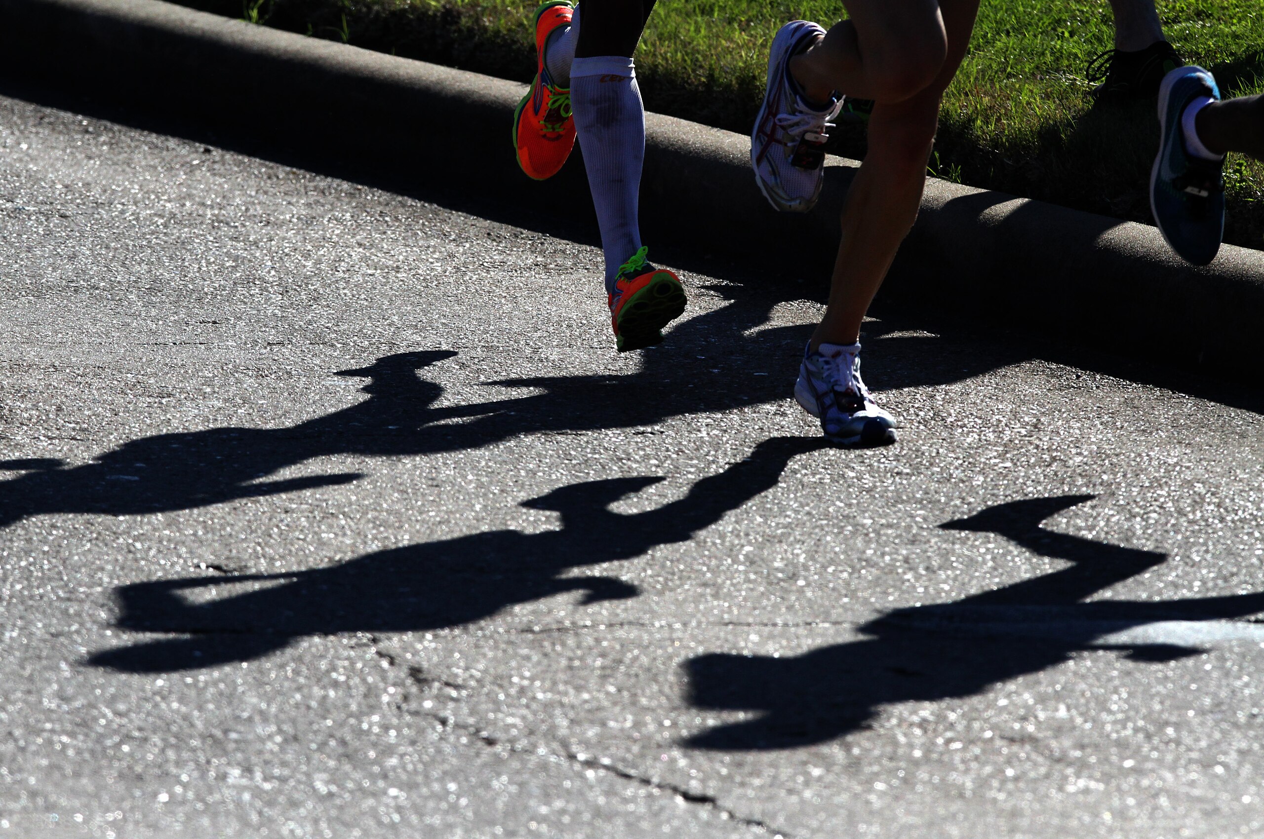 HOUSTON, TX - JANUARY 14: Runners shadows are seen as they compete in the U.S. Marathon Olympic Trials January 14, 2012 in Houston, Texas. (Photo by Thomas B. Shea/Getty Images)