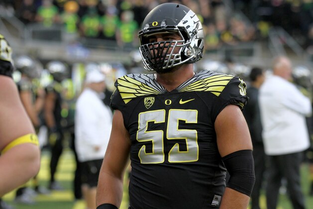 Oregon offensive lineman Hroniss Grasu (55) practices during warm-ups before an NCAA college football game against Stanford in Eugene, Ore., Saturday, Nov. 1, 2014. (AP Photo/Ryan Kang)