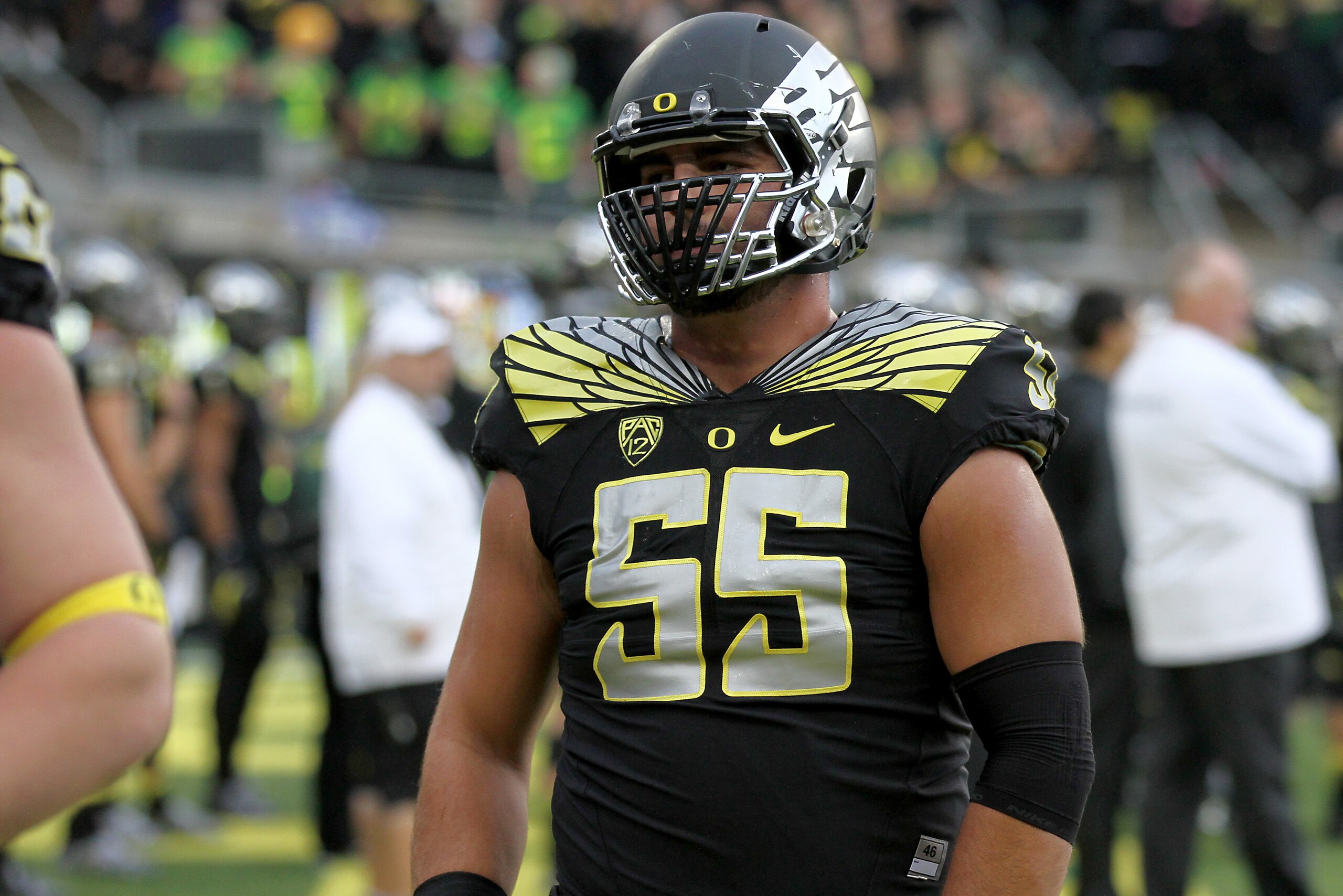 Oregon offensive lineman Hroniss Grasu (55) practices during warm-ups before an NCAA college football game against Stanford in Eugene, Ore., Saturday, Nov. 1, 2014. (AP Photo/Ryan Kang)