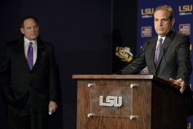 Newly appointed LSU defensive coordinator Kevin Steele, right, speaks alongside head coach Les Miles during a press conference at Louisiana State University's Athletic Administration Building in Baton Rouge, La., Wednesday, Jan. 14, 2015. (AP Photo/Hilary Scheinuk)