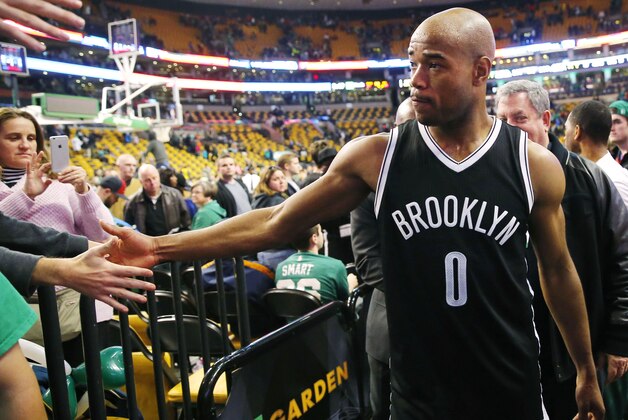 Dec 26, 2014; Boston, MA, USA; Brooklyn Nets guard Jarrett Jack (0) is congratulated by fans after their 109-107 win over the Boston Celtics at TD Garden. Mandatory Credit: Winslow Townson-USA TODAY Sports