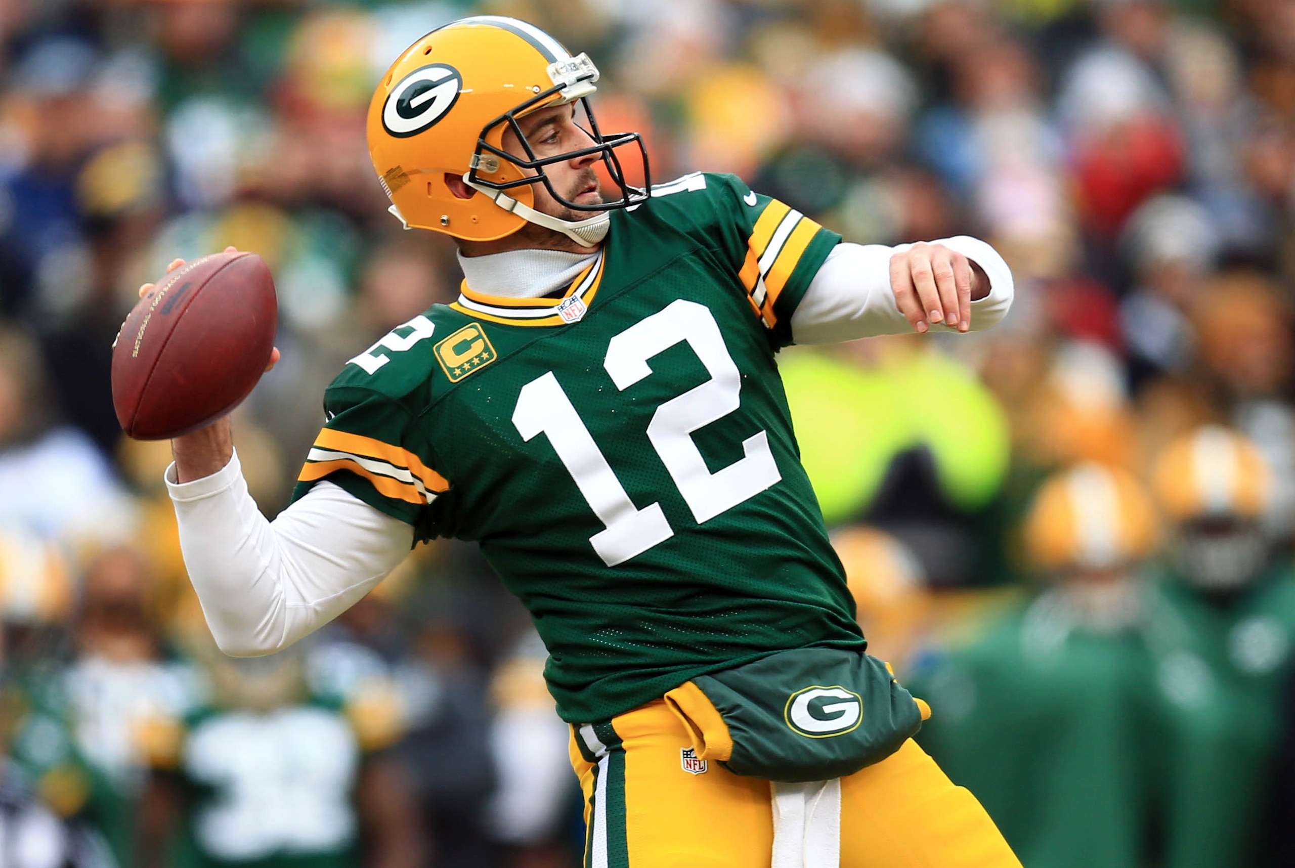 Jan 11, 2015; Green Bay, WI, USA; Green Bay Packers quarterback Aaron Rodgers throws a pass against the Dallas Cowboys in the first half in the 2014 NFC Divisional playoff football game at Lambeau Field. Mandatory Credit: Andrew Weber-USA TODAY Sports Jan 11, 2015; Green Bay, WI, USA; Green Bay Packers quarterback Aaron Rodgers throws a pass against the Dallas Cowboys in the first half in the 2014 NFC Divisional playoff football game at Lambeau Field. Mandatory Credit: Andrew Weber-USA TODAY Sports