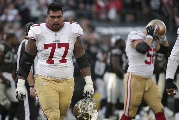 San Francisco 49ers guard Mike Iupati (77) walks off the field during the fourth quarter of an NFL football game against the Oakland Raiders in Oakland, Calif., Sunday, Dec. 7, 2014. The Raiders won 24-13. (AP Photo/Marcio Jose Sanchez)