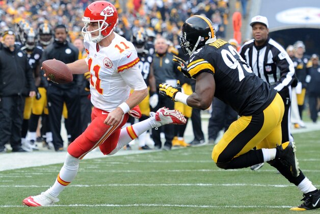 Kansas City Chiefs quarterback Alex Smith (11) scrambles around end with Pittsburgh Steelers outside linebacker Jason Worilds (93) in pursuit during the first half of an NFL football game in Pittsburgh, Sunday, Dec. 21, 2014. (AP Photo/Don Wright)