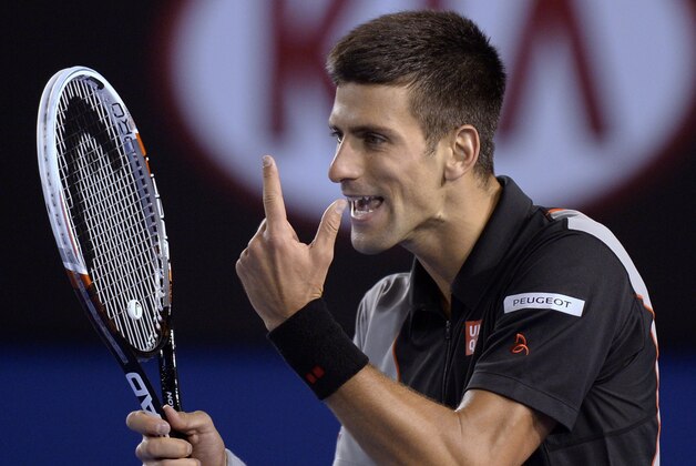 Novak Djokovic of Serbia appeals a point as he plays Stanislas Wawrinka of Switzerland during their quarterfinal at the Australian Open tennis championship in Melbourne, Australia, Tuesday, Jan. 21, 2014.(AP Photo/Andrew Brownbill)