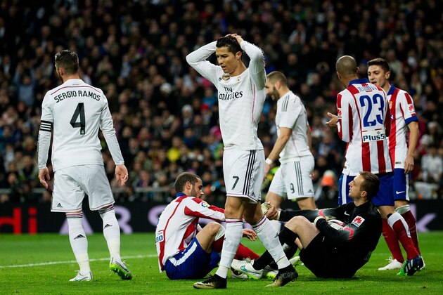 MADRID, SPAIN - JANUARY 15: Cristiano Ronaldo of Real Madrid CF reacts after failing to score during the Copa del Rey Round of 16  second leg match between Real Madrid CF and Club Atletico de Madrid at Estadio Santiago Bernabeu on January 15, 2015 in Madrid, Spain.  (Photo by Gonzalo Arroyo Moreno/Getty Images)
