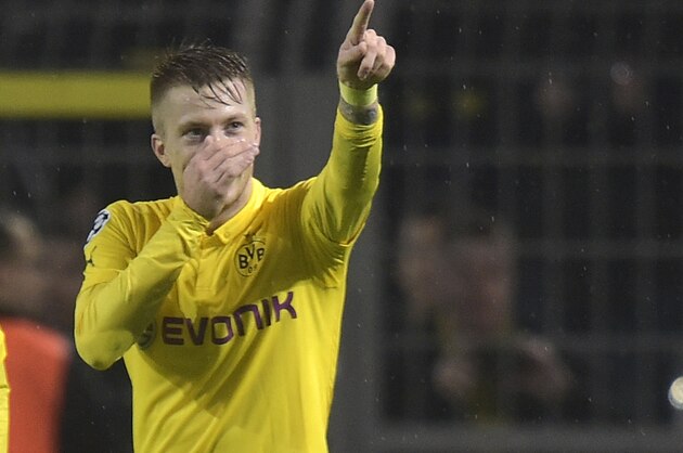 Dortmund's Marco Reus celebrates after scoring the opening goal during the Champions League group D soccer match between Borussia Dortmund and Galatasaray Istanbul in Dortmund, Germany, Tuesday, Nov.4,,2014. (AP Photo/Martin Meissner)
