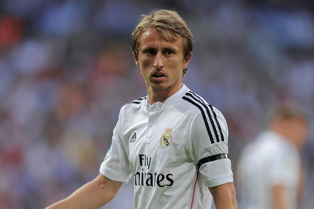 MADRID, SPAIN - SEPTEMBER 13: Luka Modric of Real Madrid looks on during the La Liga match between Real Madrid and Atletico de Madrid at Estadio Santiago Bernabeu on September 13, 2014 in Madrid, Spain.  (Photo by Denis Doyle/Getty Images)