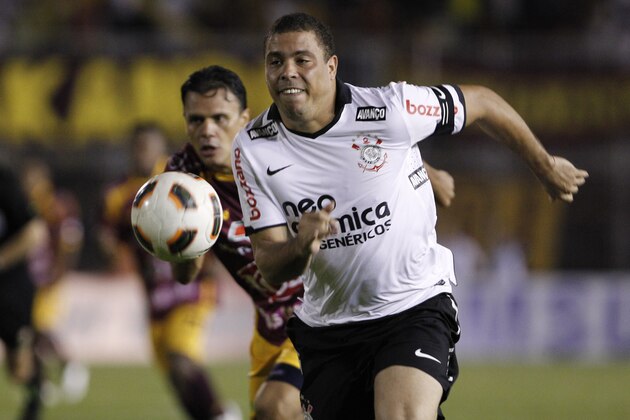 FILE - In this Feb. 2, 2011, file photo, Ronaldo of Brazil's Corinthians, front, goes for the ball followed by Gerardo Vallejo of Colombia's Deportes Tolima during a Copa Libertadores soccer match in Ibague, Colombia. Ronaldo said on Monday, Feb. 14, 2011, he is retiring from soccer because he can't stay fit anymore, ending a stellar 18-year career in which he thrived with Brazil and some of Europe's top clubs. (AP Photo/Fernando Vergara, file)