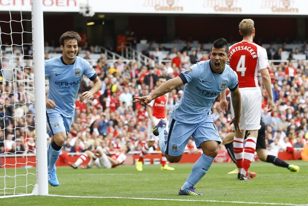 Manchester City's Sergio Aguero celebrates scoring a goal during the English Premier League soccer match between Arsenal and Manchester City at Emirates Stadium in London, Saturday, Sept. 13, 2014. (AP Photo/Kirsty Wigglesworth) Manchester City's Sergio Aguero celebrates scoring a goal during the English Premier League soccer match between Arsenal and Manchester City at Emirates Stadium in London, Saturday, Sept. 13, 2014. (AP Photo/Kirsty Wigglesworth)