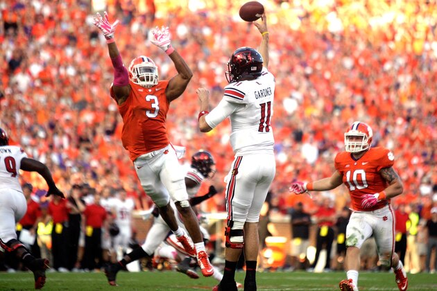 CLEMSON, SC - OCTOBER 11: Vic Beasley #3 of the Clemson Tigers attempts to block a pass by Will Gardner #11 of the Louisville Cardinals during the game at Memorial Stadium on October 11, 2014 in Clemson, South Carolina. (Photo by Tyler Smith/Getty Images)