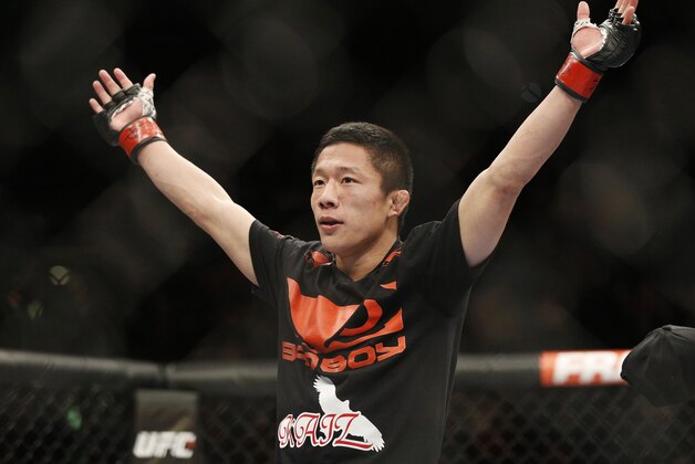 Kyoji Horiguchi celebrates after defeating Louis Gaudinot during their flyweight mixed martial arts bout at UFC 182, Saturday, Jan. 3, 2015, in Las Vegas. (AP Photo/John Locher)