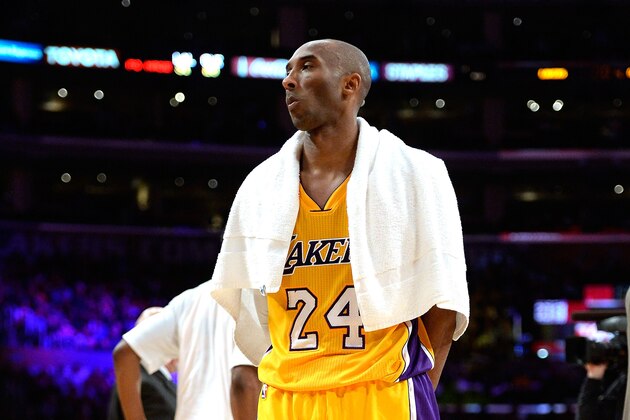 LOS ANGELES, CA - JANUARY 15:  Kobe Bryant #24 of the Los Angeles Lakers ices he knees during a 109-102 loss to the Cleveland Cavaliers at Staples Center on January 15, 2015 in Los Angeles, California.  NOTE TO USER: User expressly acknowledges and agrees that, by downloading and or using this Photograph, user is consenting to the terms and condition of the Getty Images License Agreement.  (Photo by Harry How/Getty Images)