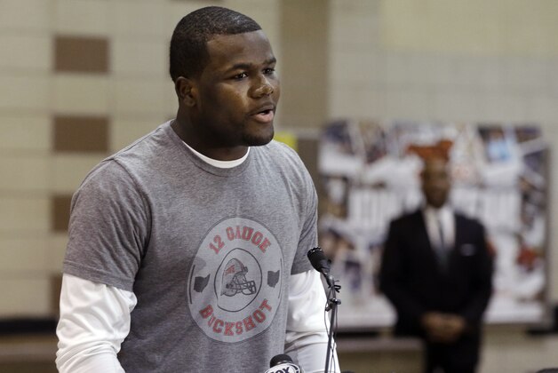 Ohio State quarterback Cardale Jones announces he will not enter the NFL draft at a news conference in Cleveland, Thursday, Jan. 15, 2015. Jones, 3-0 as a college starter including a win in the national championship game, says he will return to the Buckeyes for his final two years of eligibility. (AP Photo/Mark Duncan)