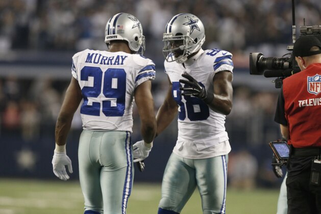 After Dallas Cowboys running back DeMarco Murray (29) celebrates a touchdown with wide receiver Dez Bryant (88) during the second half of an NFL wildcard playoff football game against the Detroit Lions, Sunday, Jan. 4, 2015, in Arlington, Texas. (AP Photo/Brandon Wade)