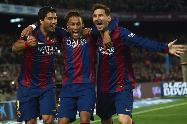 FC Barcelona's Lionel Messi, from Argentine, right, Neymar, from Brazil, center, and Luis Suarez, from Uruguay, celebrate after scoring against Atletico Madrid during a Spanish La Liga soccer match at the Camp Nou stadium in Barcelona, Spain, Sunday, Jan. 11, 2015. (AP Photo/Siu Wu)