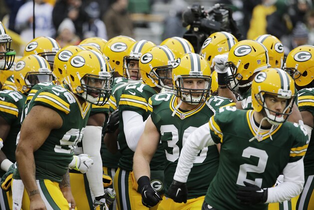 The Green Bay Packers take the field before an NFL divisional playoff football game against the Dallas Cowboys Sunday, Jan. 11, 2015, in Green Bay, Wis. (AP Photo/Nam Y. Huh)