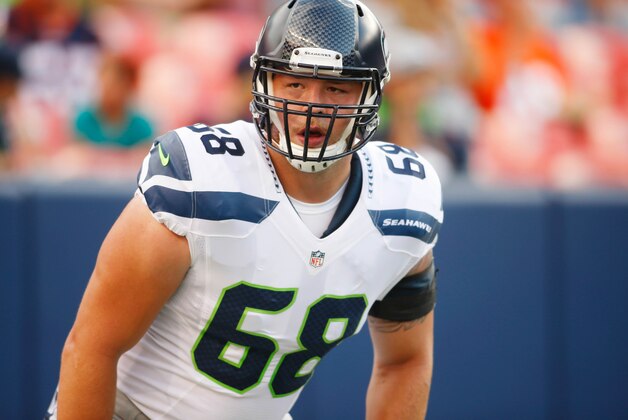 Aug 7, 2014; Denver, CO, USA; Seattle Seahawks guard Justin Britt (68)  before the preseason game against the Denver Broncos at Sports Authority Field at Mile High. Mandatory Credit: Chris Humphreys-USA TODAY Sports