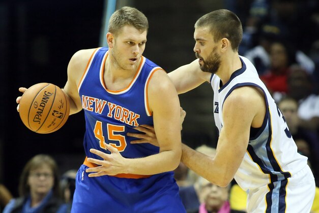 Jan 5, 2015; Memphis, TN, USA; New York Knicks center Cole Aldrich (45) drives against Memphis Grizzlies center Marc Gasol (33) during the first half at FedExForum. Mandatory Credit: Nelson Chenault-USA TODAY Sports