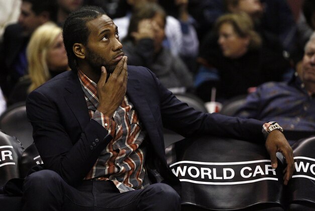Jan 6, 2015; San Antonio, TX, USA; San Antonio Spurs small forward Kawhi Leonard (2) watches from the bench during the first half against the Detroit Pistons at AT&T Center. Mandatory Credit: Soobum Im-USA TODAY Sports