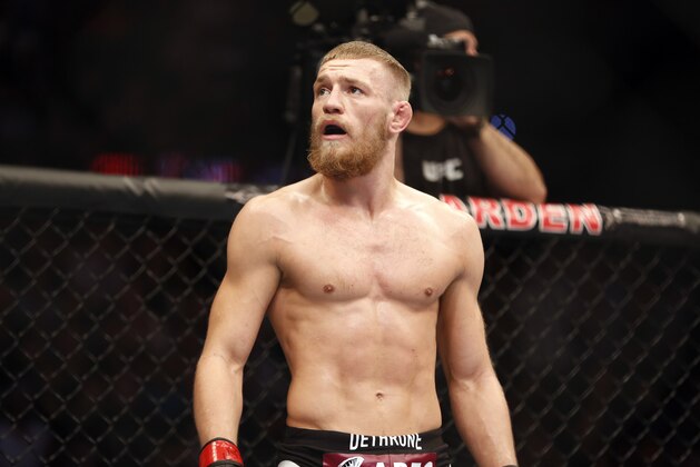 Conor McGregor is seen against Max Holloway in their UFC on Fox Sports 1 mixed martial arts bout in Boston, Saturday, August 17,2013. McGregor won via unanimous decision. (AP Photo/Gregory Payan)