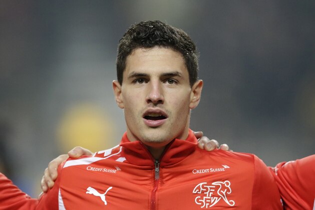 Switzerland's Fabian Schar lines up before their friendly soccer match against South Korea at Seoul World Cup Stadium in Seoul, South Korea, Friday, Nov. 15, 2013. (AP Photo/Lee Jin-man)