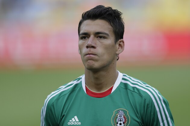Mexico's Hector Moreno stands during the playing of the Italian national anthem before the soccer Confederations Cup group A match between Mexico and Italy at Maracana stadium in Rio de Janeiro, Brazil, Sunday, June 16, 2013. (AP Photo/Felipe Dana)